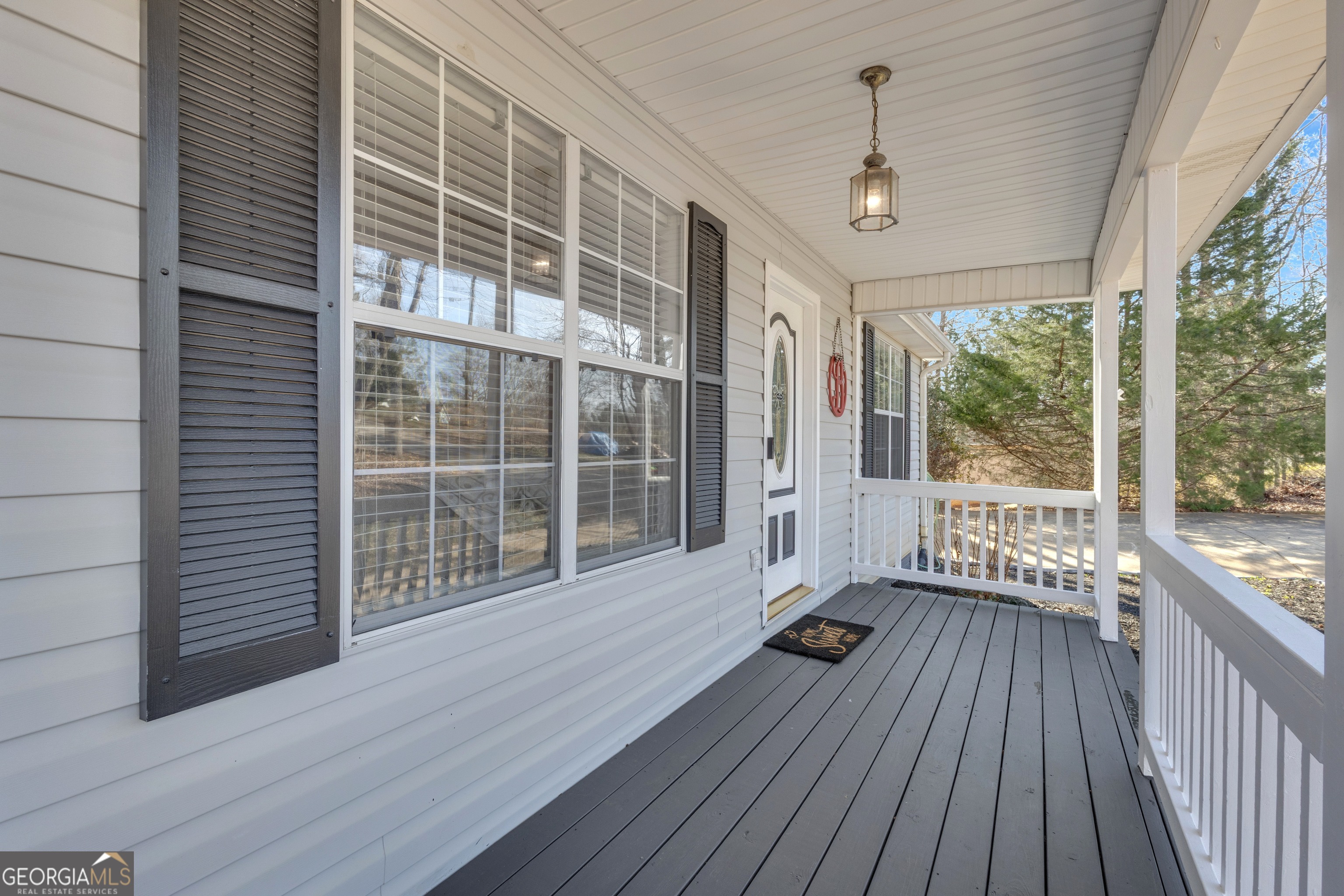 918 Scarletts Walk Locust Grove, GA 30248 - Photo 5 of 46 a view of a balcony with wooden floor