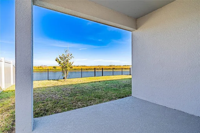 a view of a big yard with an outdoor seating