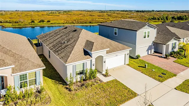 an aerial view of residential houses with outdoor space