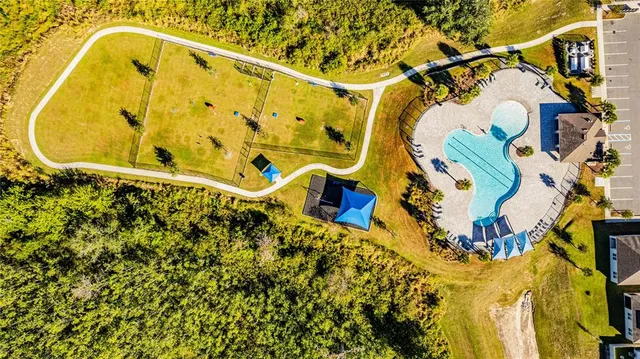 a bathroom with a mirror and a bathtub