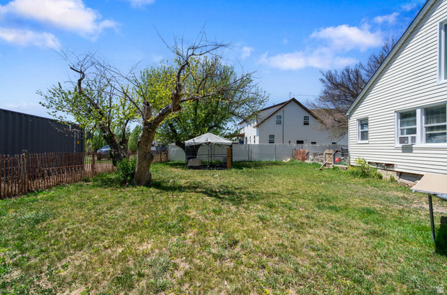 137 West 200 S Street Fairview, UT 84629 - Photo 21 of 34 Spacious backyard with a large tree and established lawn