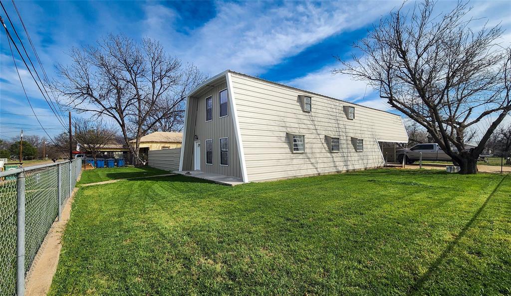 401 East Pierce Street Winters, TX 79567 - Photo 25 of 25 a view of a backyard with a garden