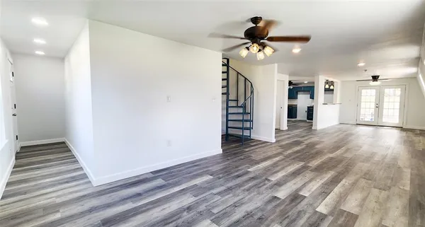a view of a livingroom with wooden floor