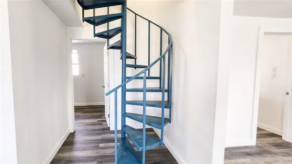 a view of entryway with wooden floor