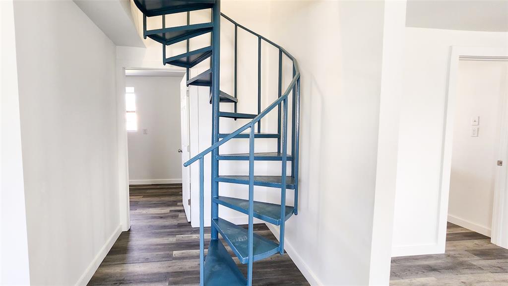 401 East Pierce Street Winters, TX 79567 - Photo 10 of 25 a view of entryway with wooden floor