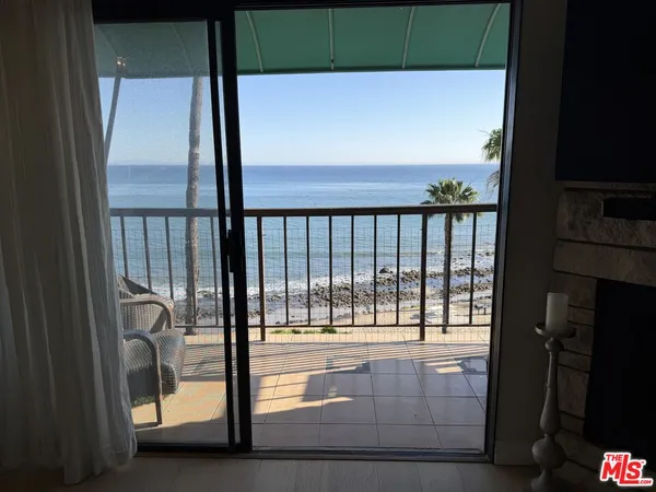 a view of balcony with furniture