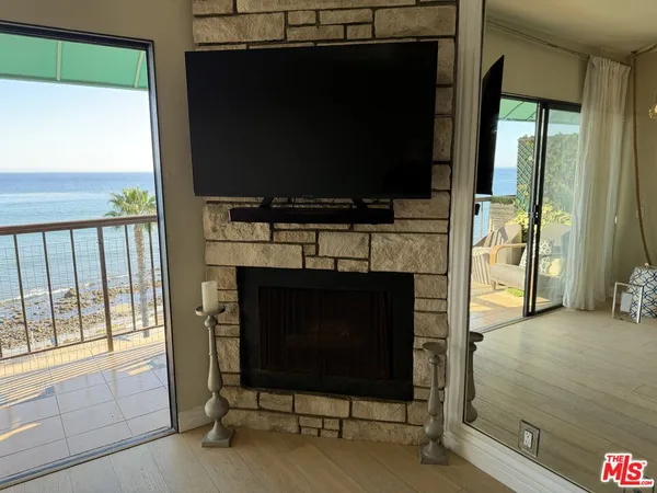 wooden floor in an empty room with a fireplace