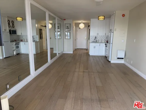 a view of a kitchen from the hallway
