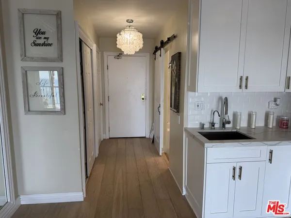 a kitchen with stainless steel appliances a stove a microwave and a refrigerator