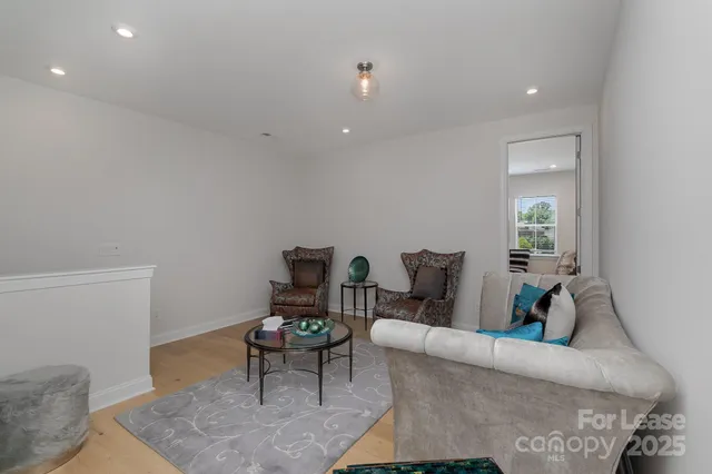 a bathroom with a sink toilet vanity and tub