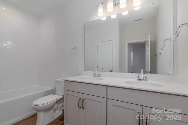 a stove top oven sitting inside of a kitchen