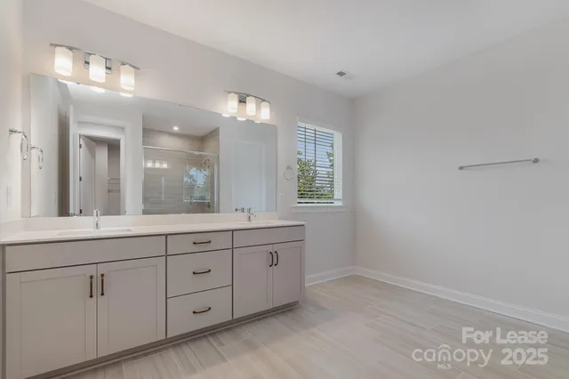 a bathroom with a shower and a toilet