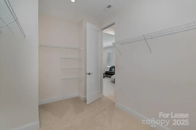 a view of a room with racks on the wall