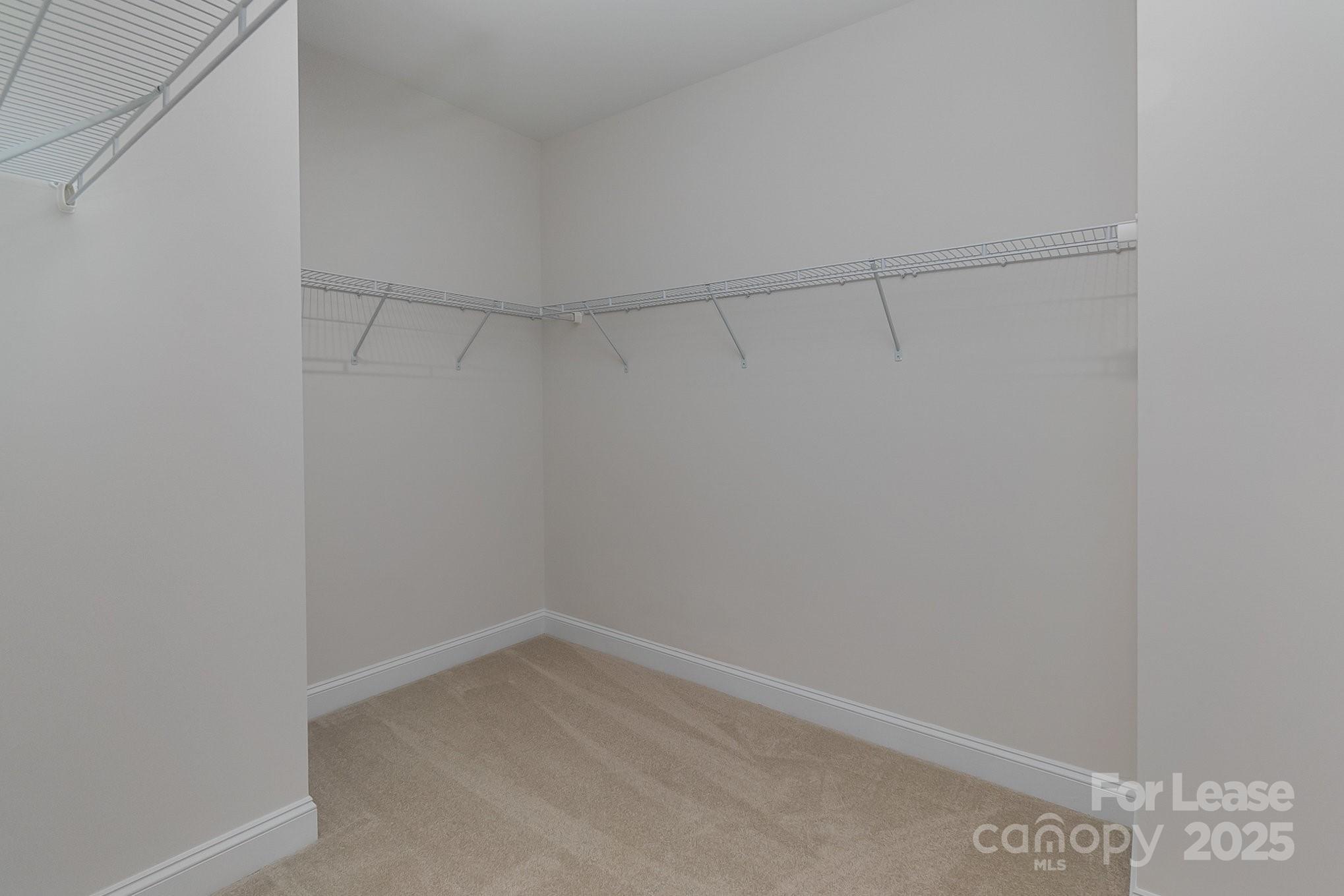 3224 Everly Enclave Way Charlotte, NC 28210 - Photo 19 of 24 a view of a room with racks on the wall