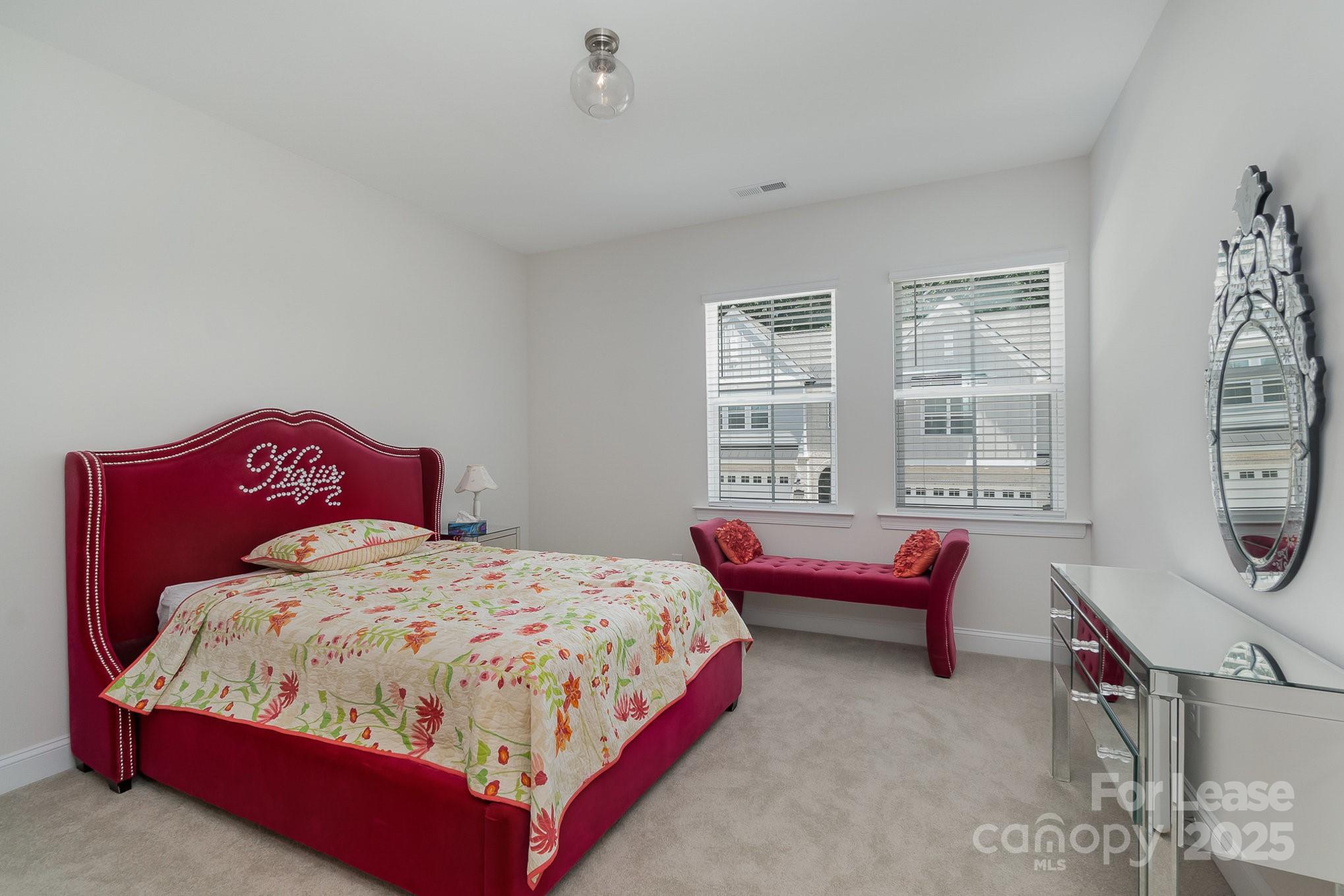 3224 Everly Enclave Way Charlotte, NC 28210 - Photo 20 of 24 a bedroom with a bed and window