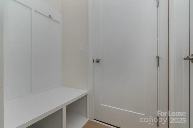 a view of a patio with couches and a potted plant on a table