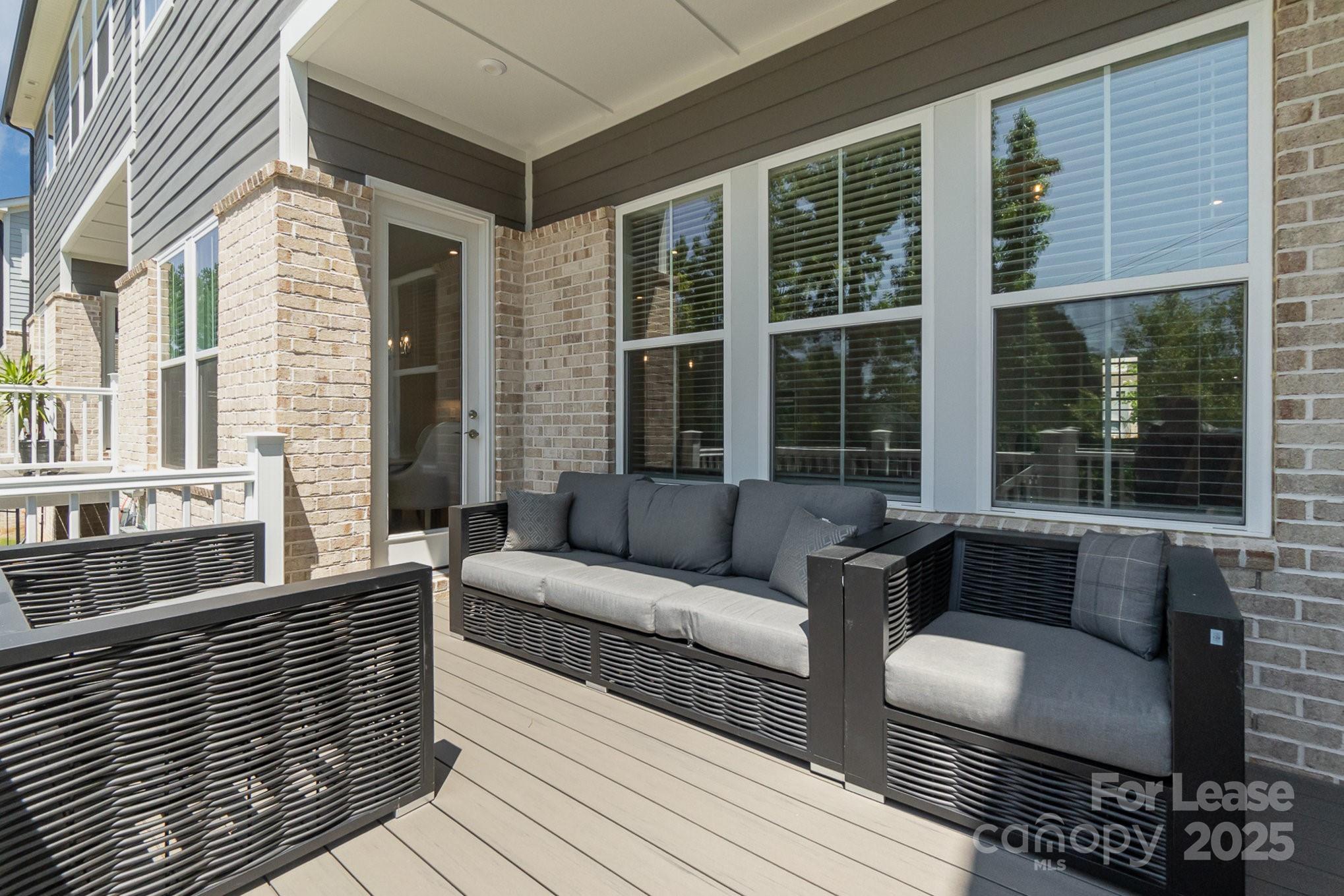 3224 Everly Enclave Way Charlotte, NC 28210 - Photo 23 of 24 a view of a patio with couches and a potted plant on a table