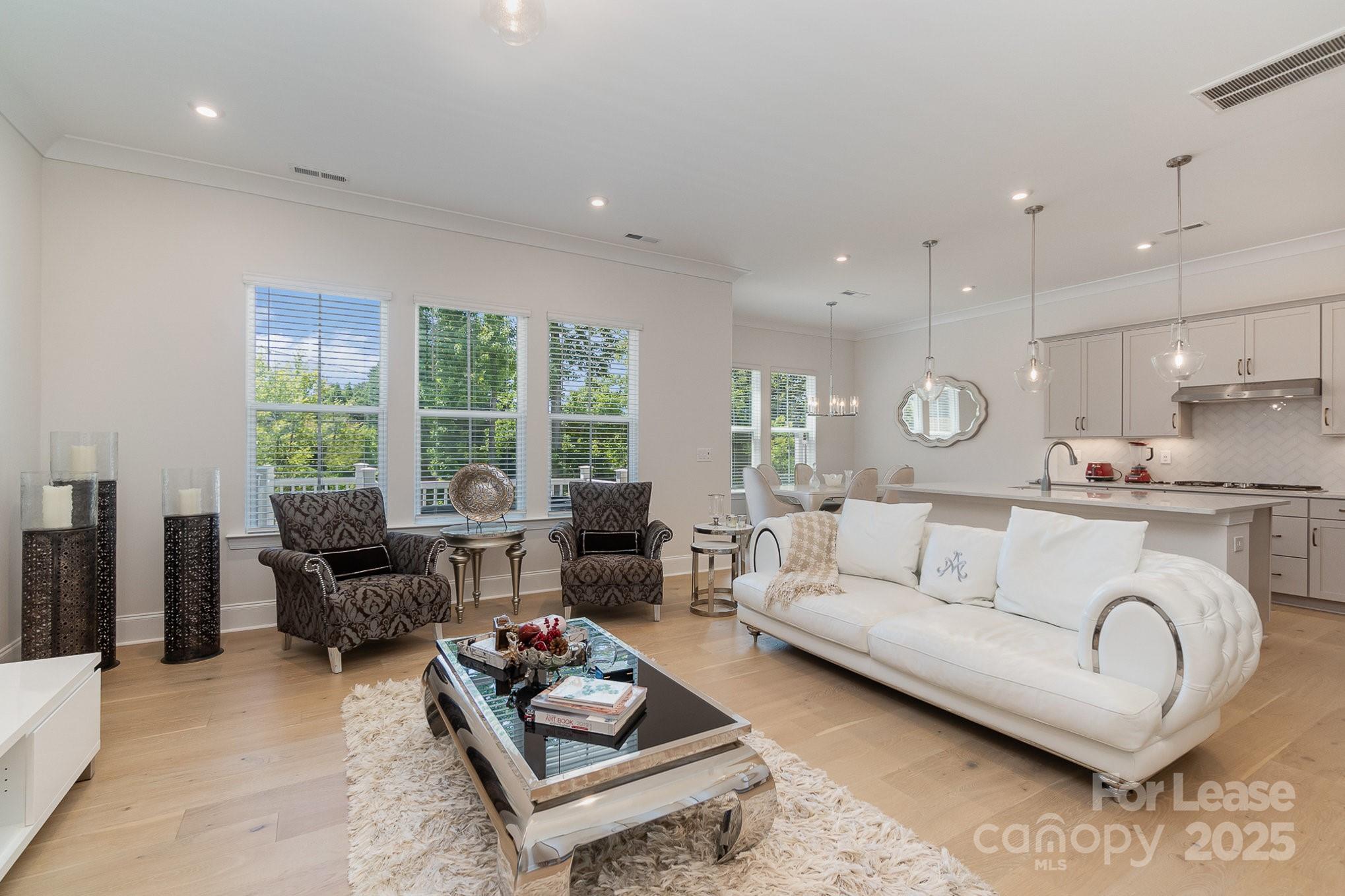 3224 Everly Enclave Way Charlotte, NC 28210 - Photo 3 of 24 a living room with furniture and a large window