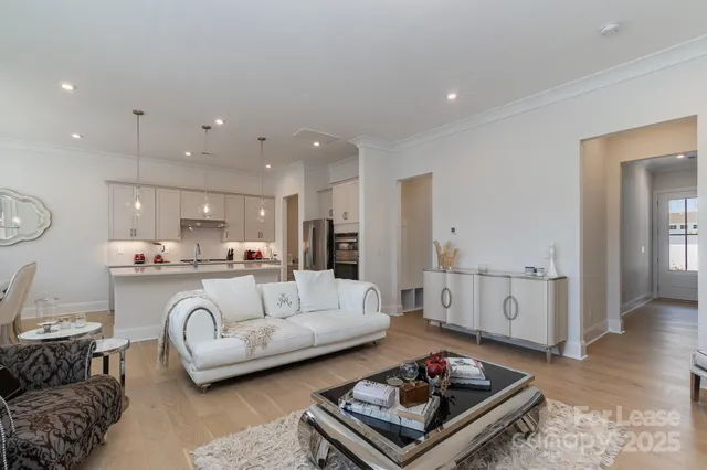 a kitchen with kitchen island granite countertop a sink cabinets and stainless steel appliances