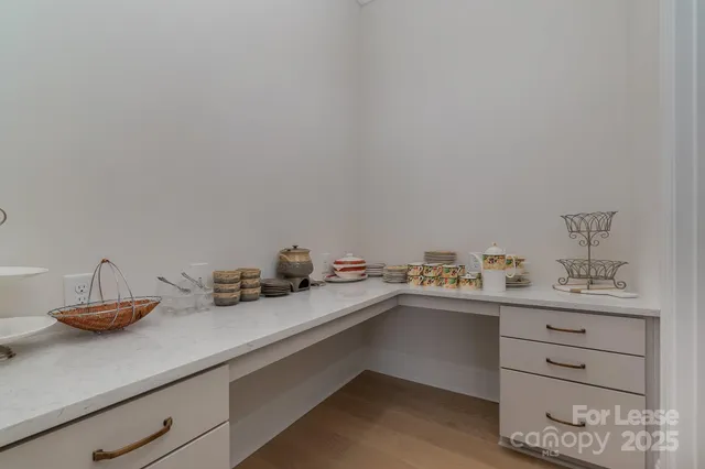 a living room with furniture and a chair