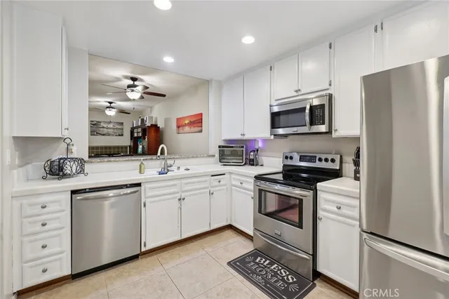 a kitchen with a sink stove and refrigerator