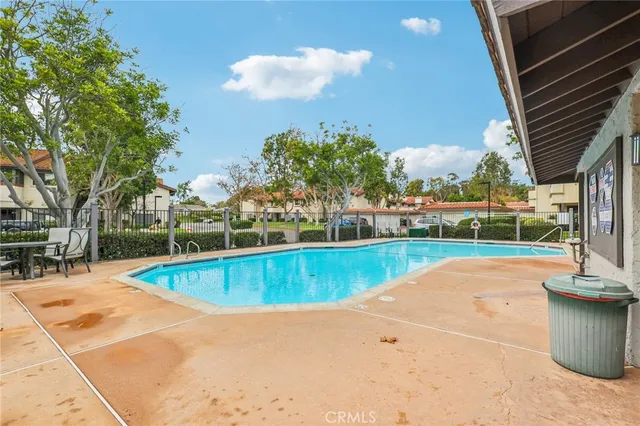 a view of a swimming pool with a patio