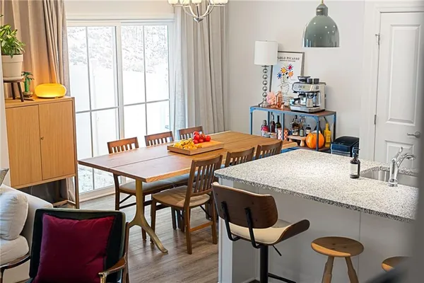 a kitchen with granite countertop lots of counter top space and furniture