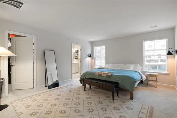 a living room with a couch and windows
