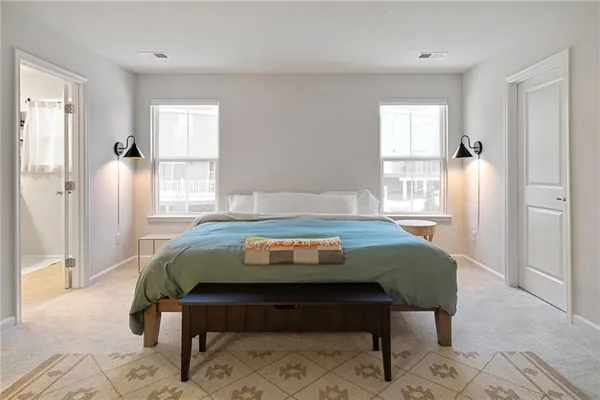a bedroom with a bed and a dresser