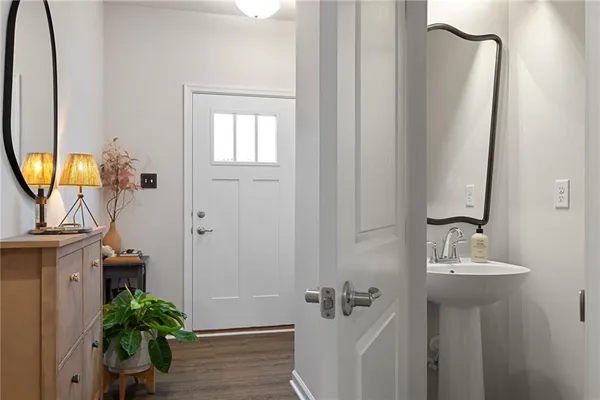 a bathroom with a sink a mirror and a shower