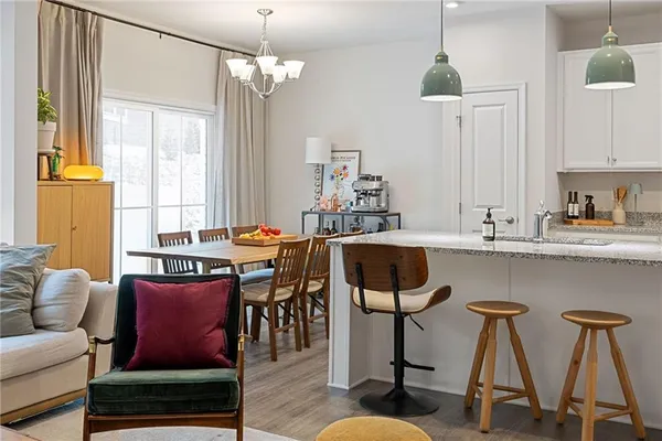 a living room with furniture a window and appliances