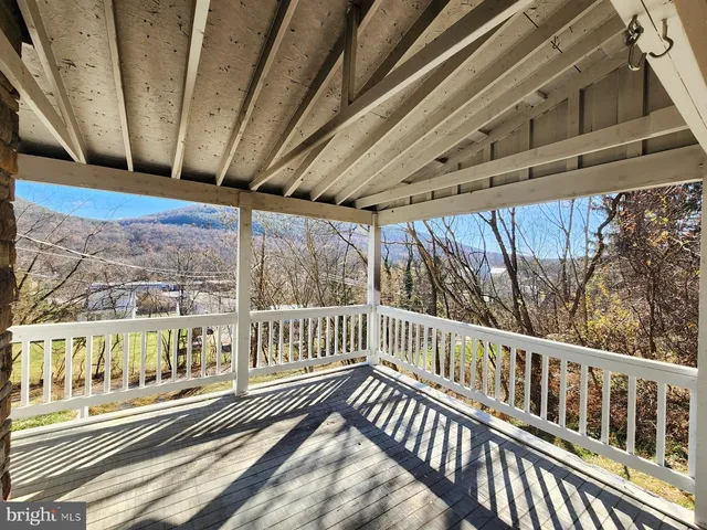 a view of a balcony with car parked