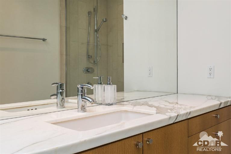 70288 Calico Road Rancho Mirage, CA 92270 - Photo 17 of 20 a bathroom with a sink and a mirror