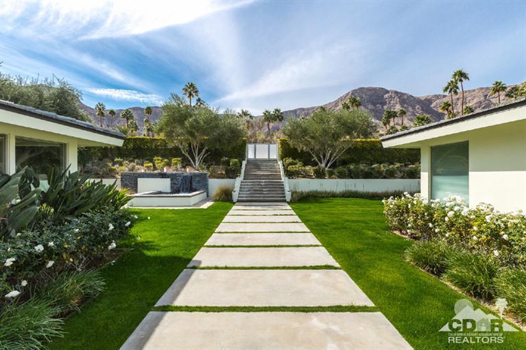 70288 Calico Road Rancho Mirage, CA 92270 - Photo 3 of 20 a front view of a house with garden