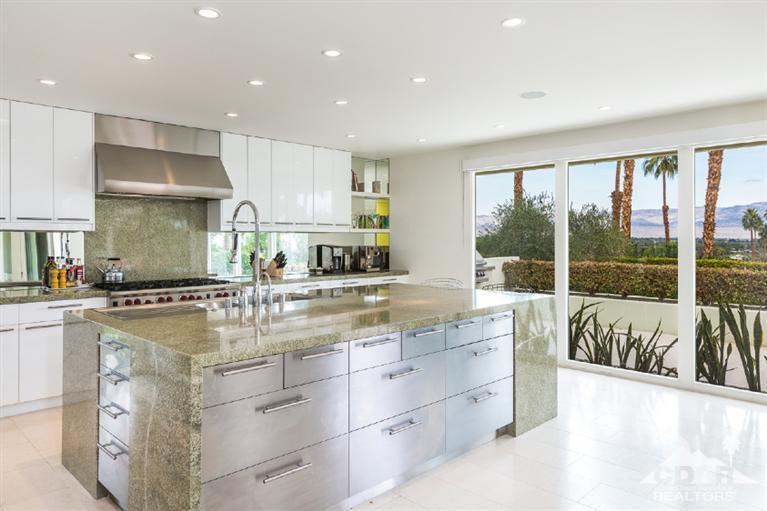 70288 Calico Road Rancho Mirage, CA 92270 - Photo 10 of 20 a kitchen with a stove a sink and cabinets
