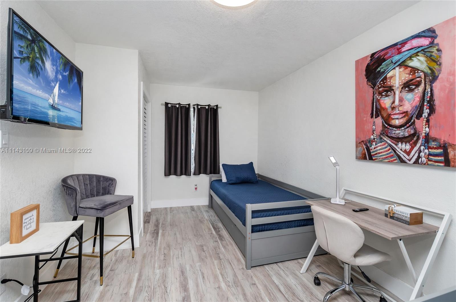 231 Northwest 44th Street Miami, FL 33127 - Photo 15 of 63 a living room with furniture and a wooden floor