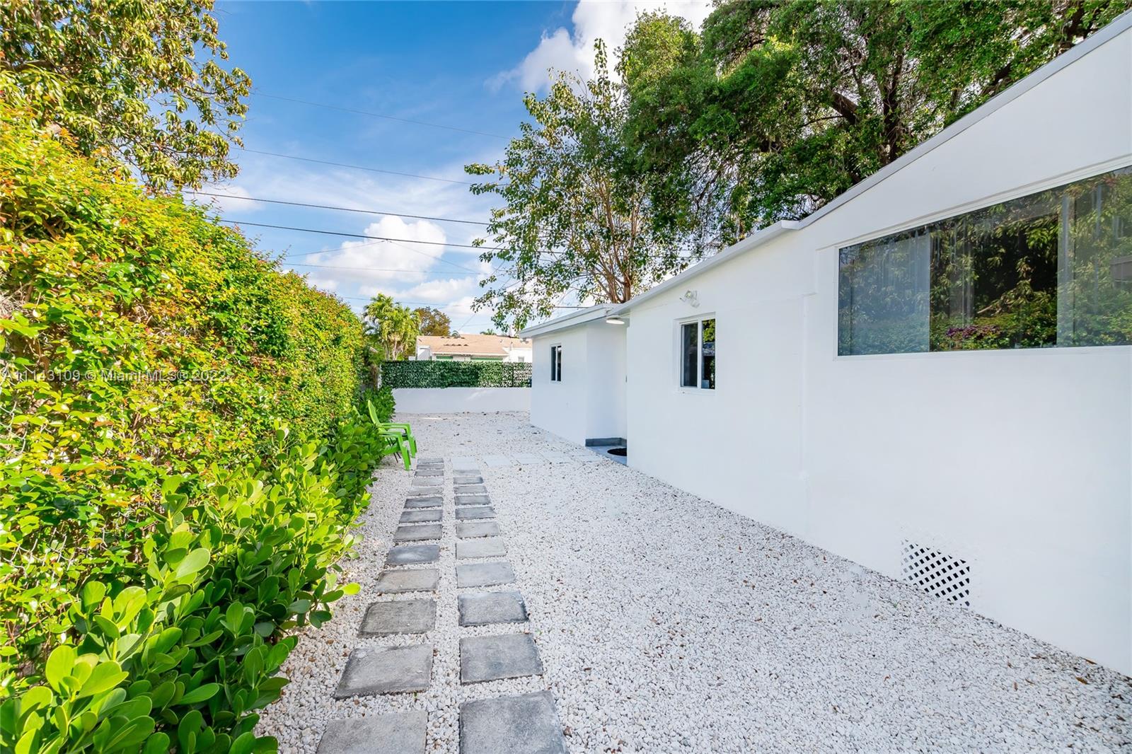 231 Northwest 44th Street Miami, FL 33127 - Photo 4 of 63 a backyard of a house with lots of green space