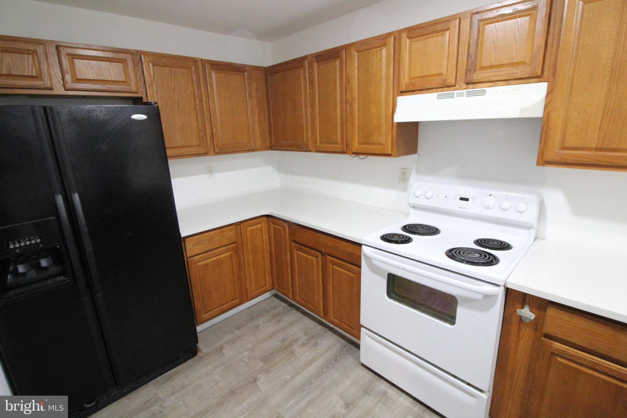 310 Piute Trail Browns Mills, NJ 08015 - Photo 8 of 23 a kitchen with a refrigerator stove and cabinets
