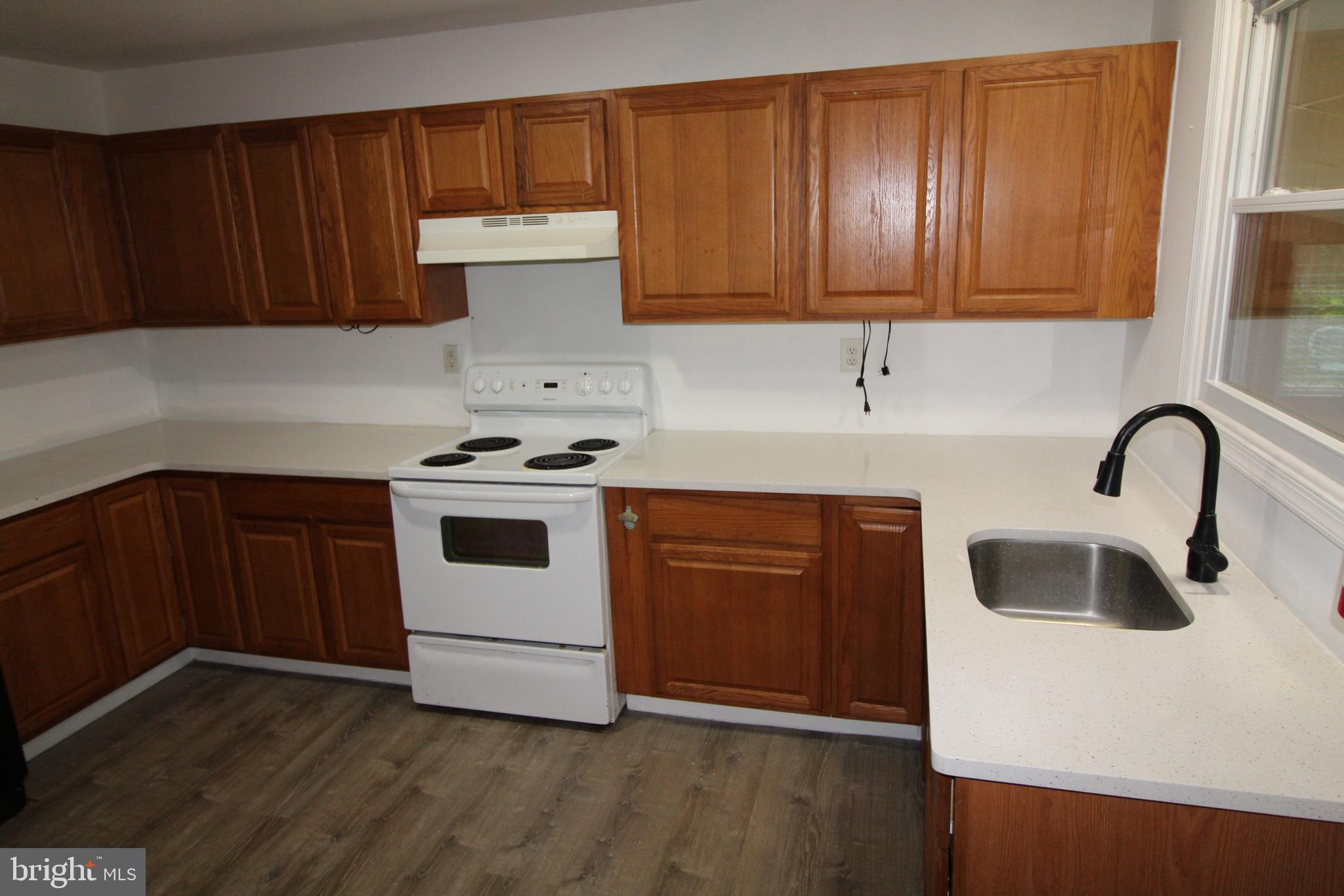 310 Piute Trail Browns Mills, NJ 08015 - Photo 9 of 23 a kitchen with granite countertop white cabinets and white appliances