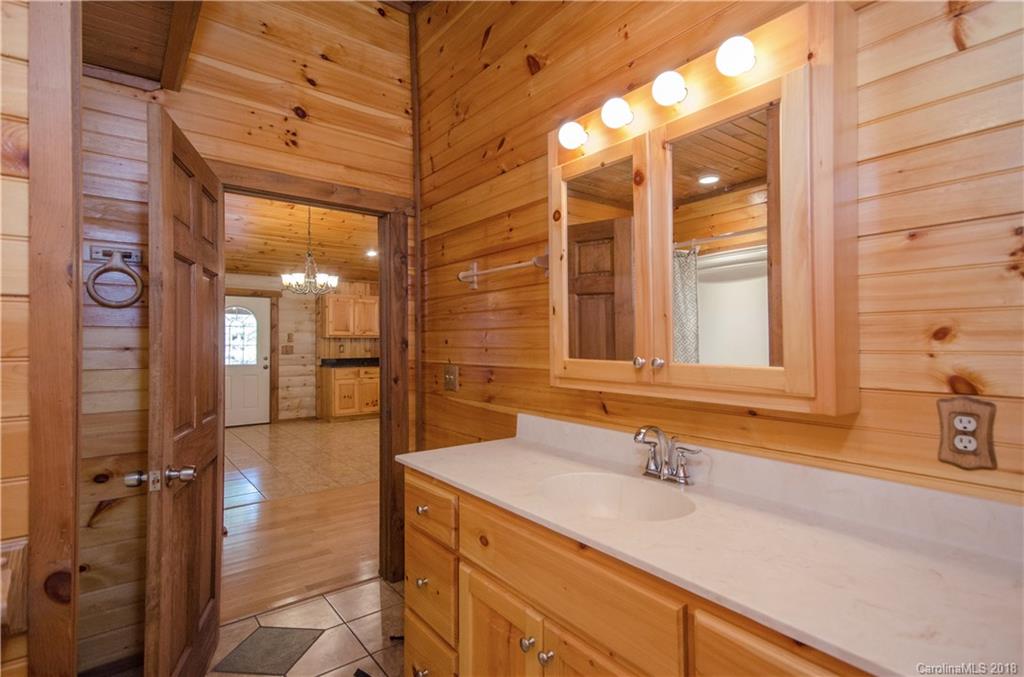 139 Stanley Ln Mill Spring, Unit 8 Mill Spring, NC 28756 - Photo 14 of 22 a bathroom with a sink and a shower