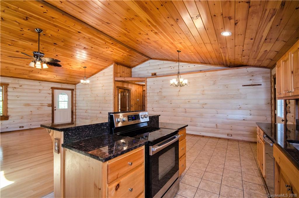 139 Stanley Ln Mill Spring, Unit 8 Mill Spring, NC 28756 - Photo 6 of 22 a kitchen view of a fireplace