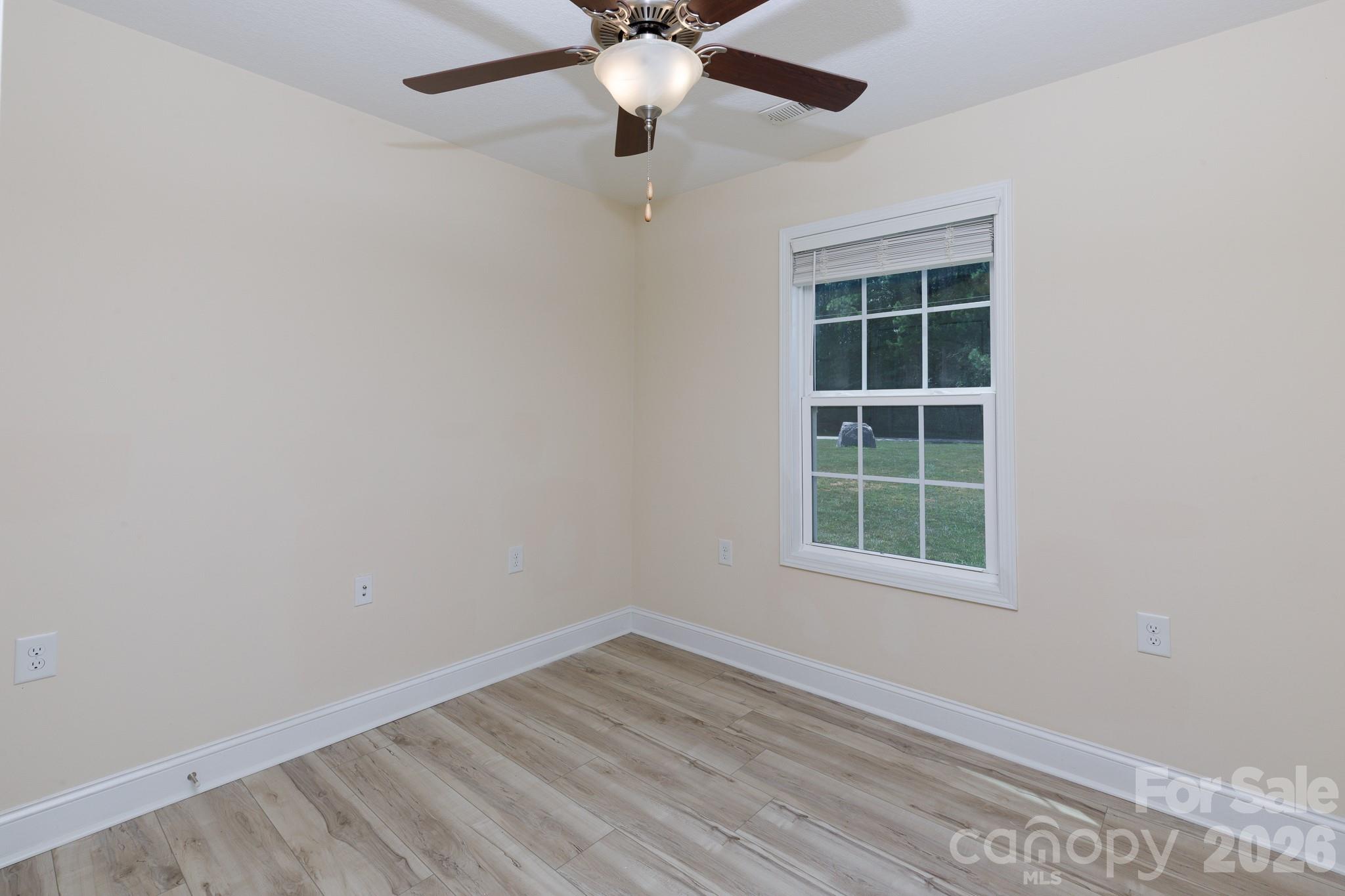 3692 Armstrong Ford Road Rock Hill, SC 29730 - Photo 20 of 30 an empty room with a window and a fan