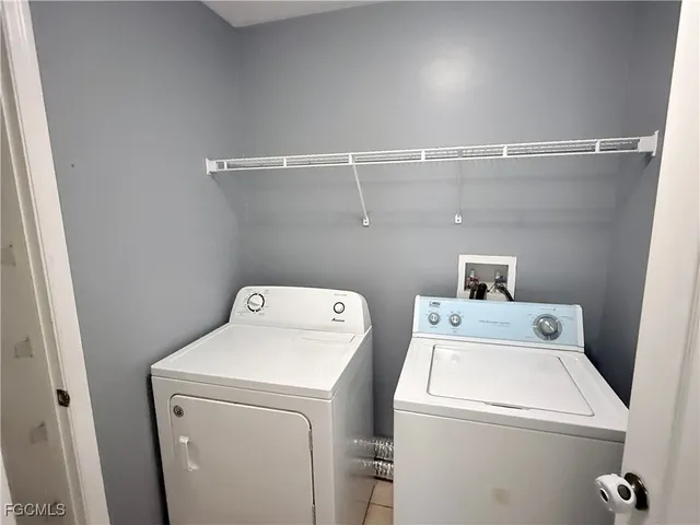a utility room with dryer and washer