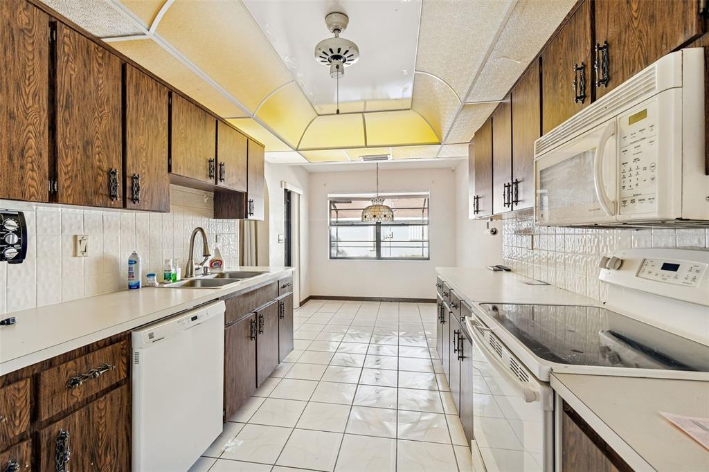 2051 Laredo Avenue Spring Hill, FL 34608 - Photo 15 of 76 a kitchen with a sink a stove and cabinets