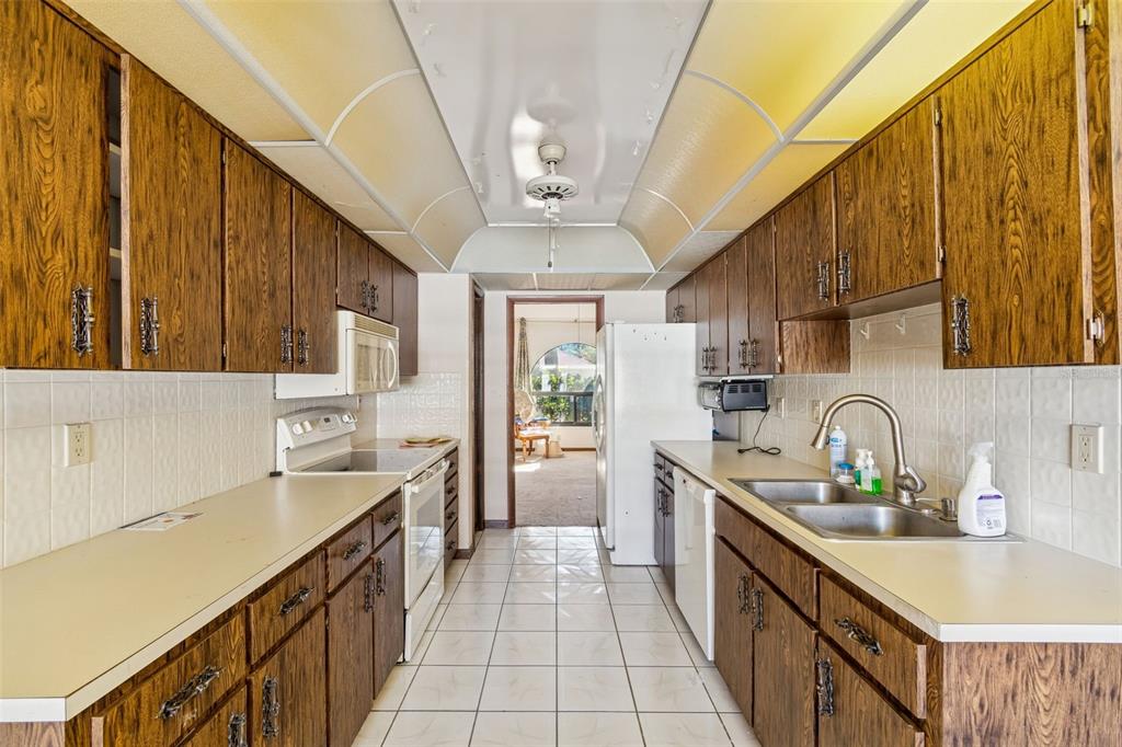2051 Laredo Avenue Spring Hill, FL 34608 - Photo 17 of 76 a kitchen with stainless steel appliances a sink stove and cabinets