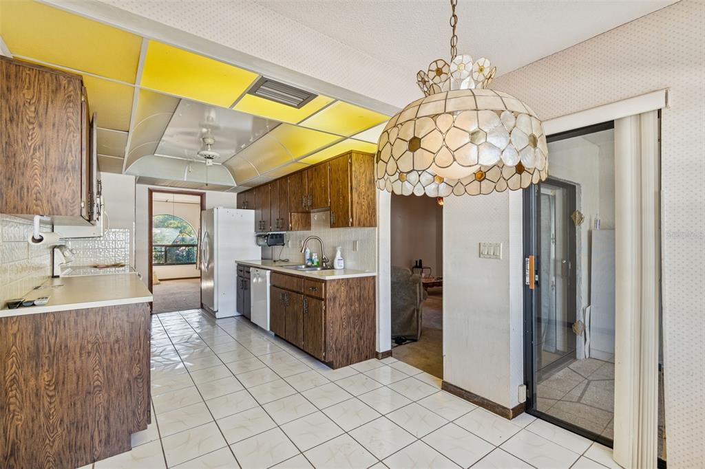 2051 Laredo Avenue Spring Hill, FL 34608 - Photo 21 of 76 a kitchen with stainless steel appliances granite countertop a sink and cabinets