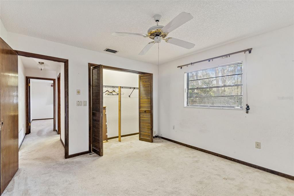 2051 Laredo Avenue Spring Hill, FL 34608 - Photo 30 of 76 an empty room with fan and windows