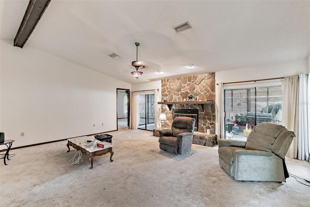 2051 Laredo Avenue Spring Hill, FL 34608 - Photo 32 of 76 a living room with furniture and a large window