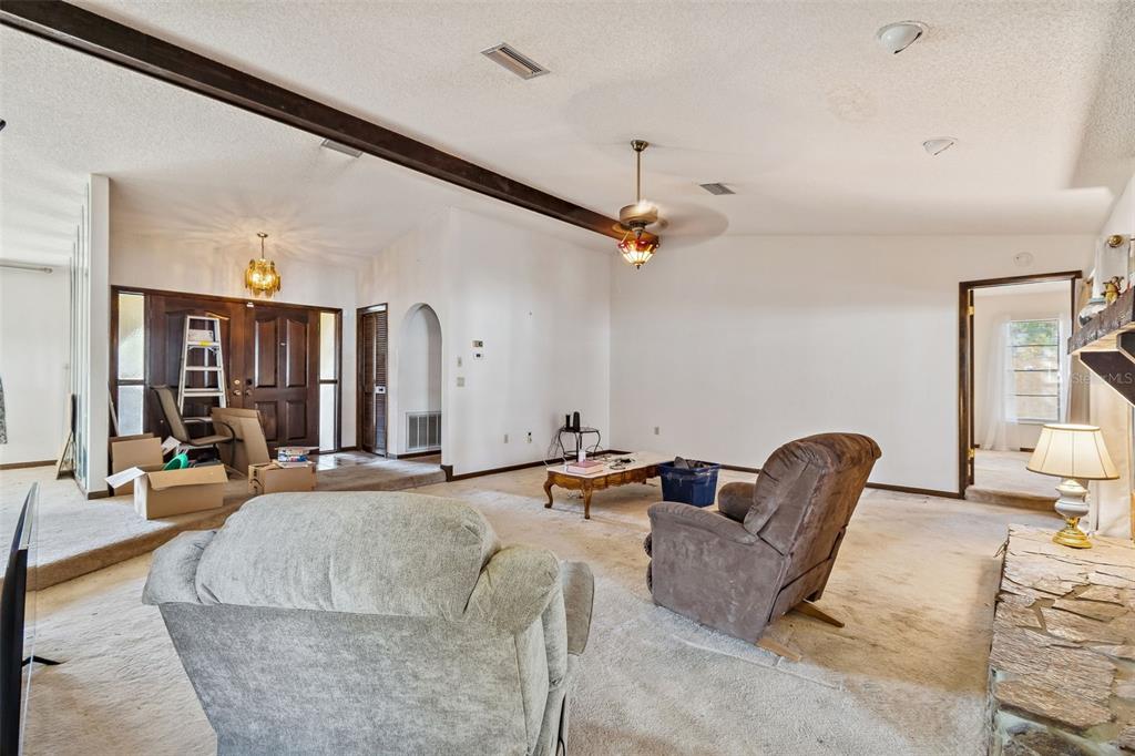 2051 Laredo Avenue Spring Hill, FL 34608 - Photo 33 of 76 a living room with furniture and flat screen tv