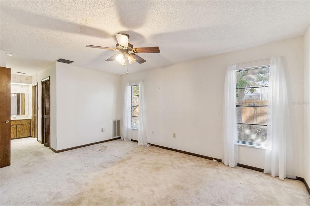2051 Laredo Avenue Spring Hill, FL 34608 - Photo 39 of 76 a view of empty room with ceiling fan